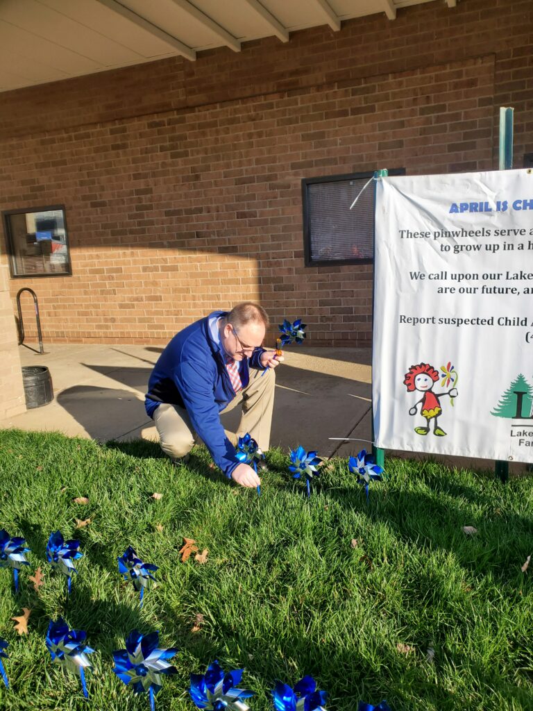 Judge DeLeone planting flower wheel