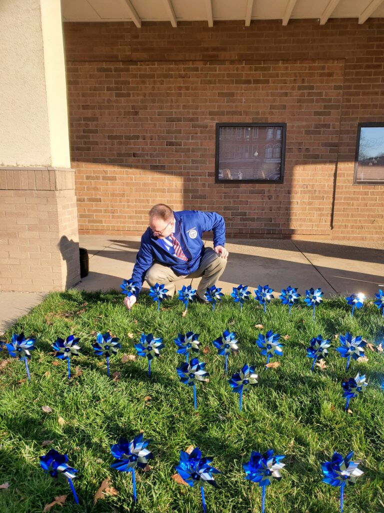 Judge DeLeone planting flower wheel
