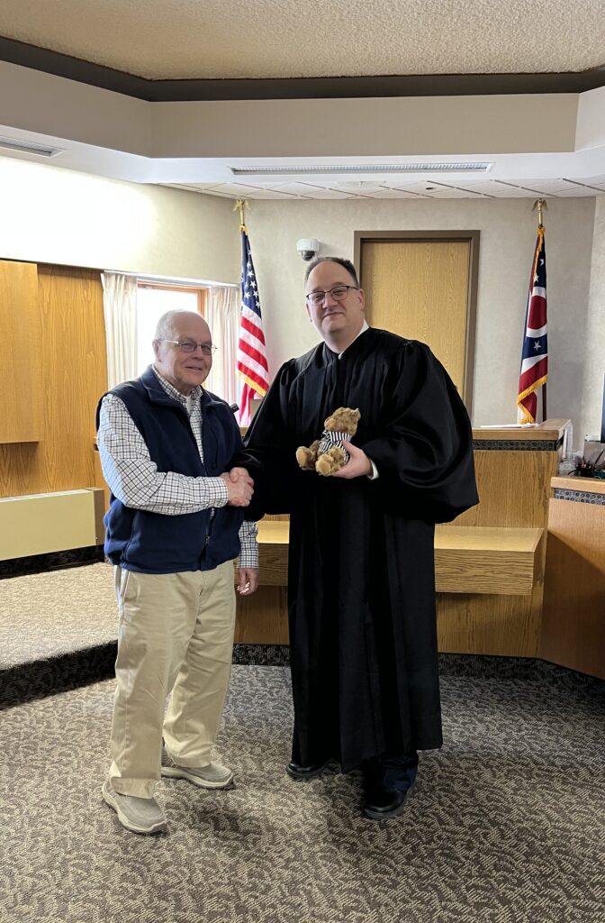 Richard Norton and Judge DeLeone in courtroom