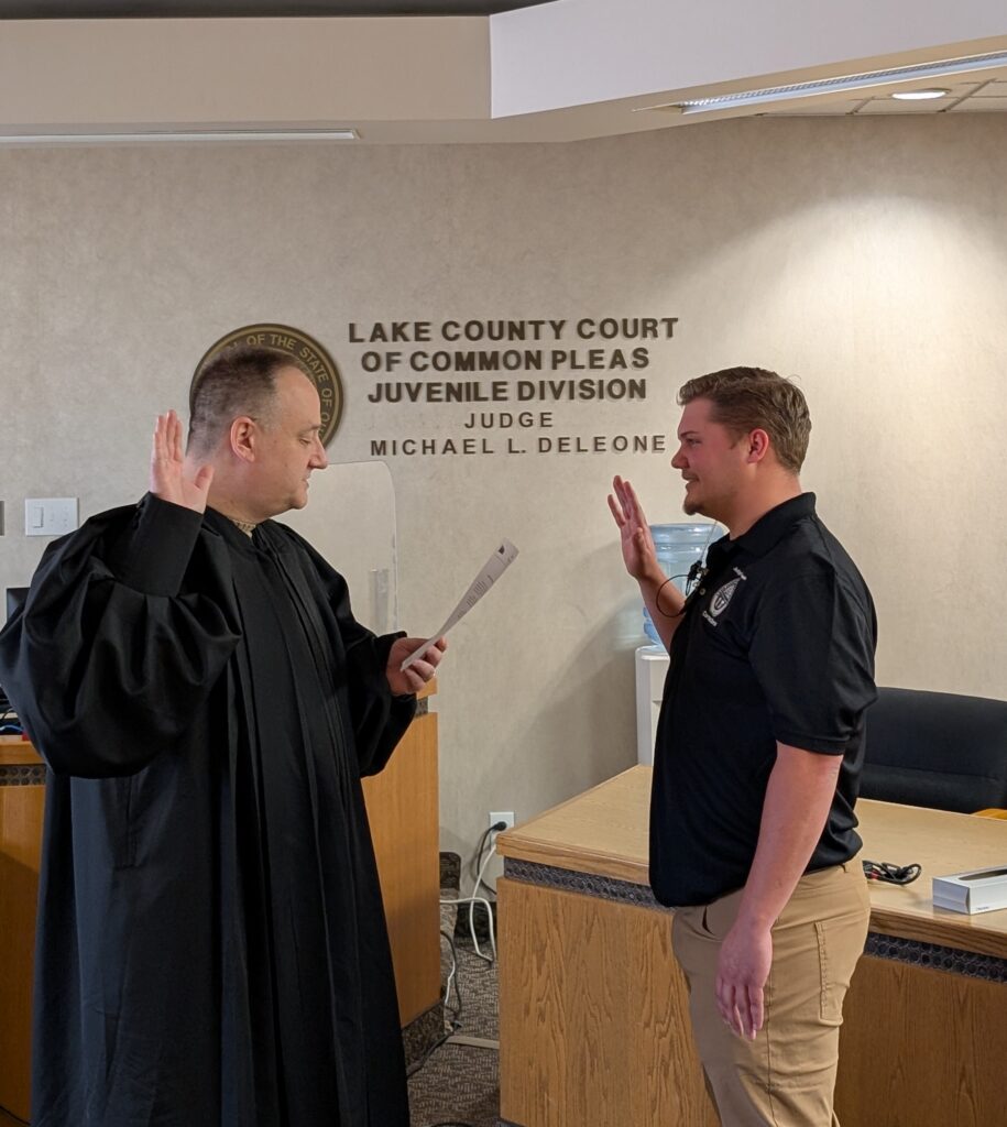 Judge DeLeone swearing in John Jusko as a Juvenile Corrections Officer.