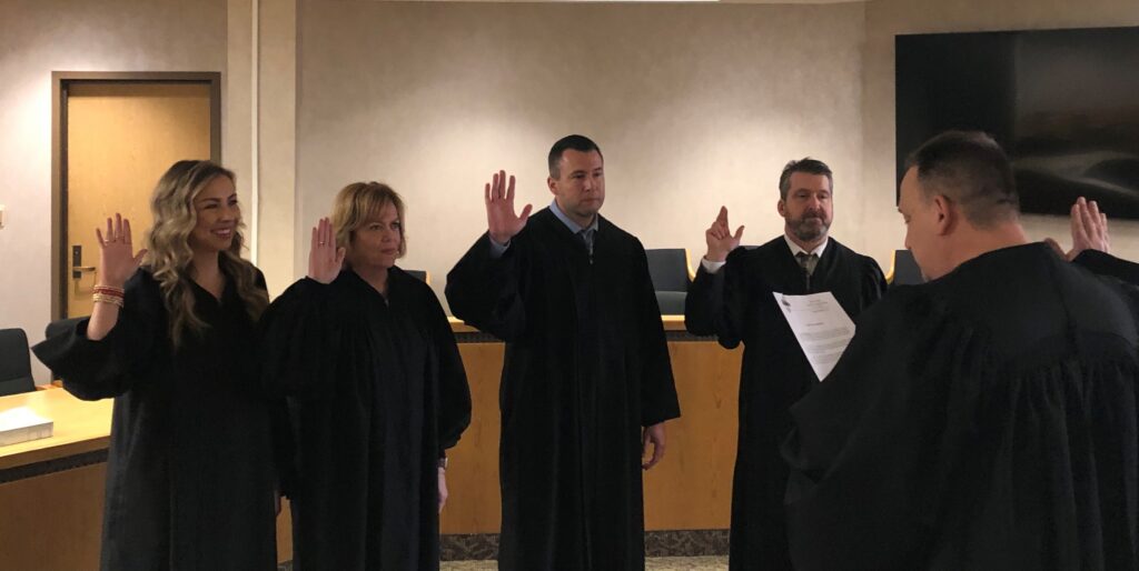 Lake County Juvenile Court Magistrates (Jessica Wright, Janette Bell, Christopher Tucci, and Ben Neylon) renewing their Oaths of Office under Judge Michael L. DeLeone.