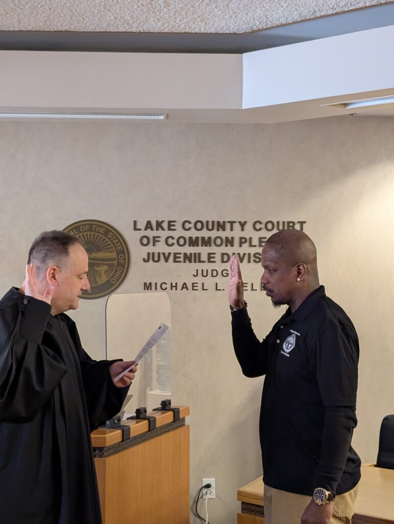 Judge DeLeone swearing in Ken Swindler as a Juvenile Corrections Officer.