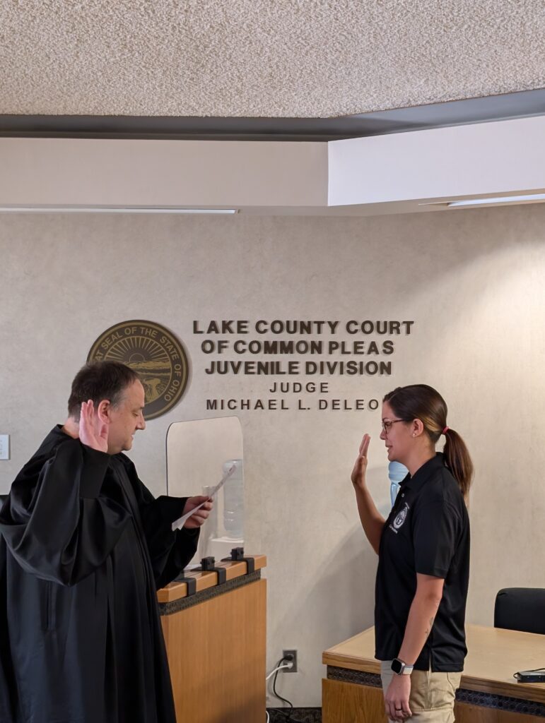 Judge DeLeone swearing in Nina and Nathaniel as Juvenile Corrections Officers.