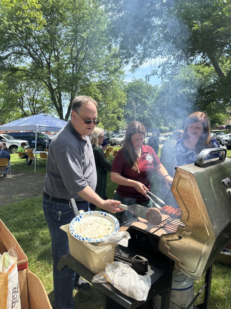 Judge DeLeone working the grill for the Juvenile Court's Memorial Day Cookout