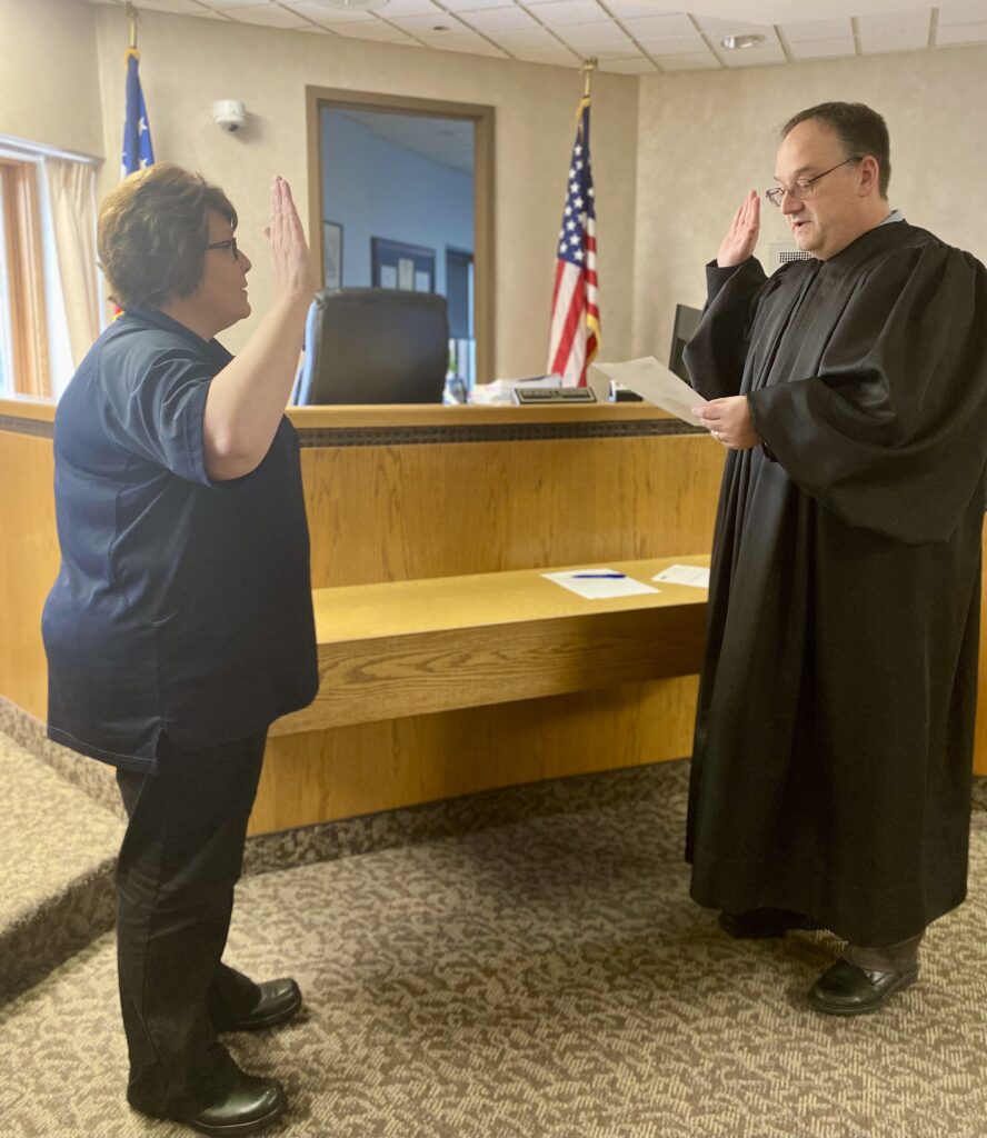 Judge DeLeone swears in a clerks from the Painesville Police Department.