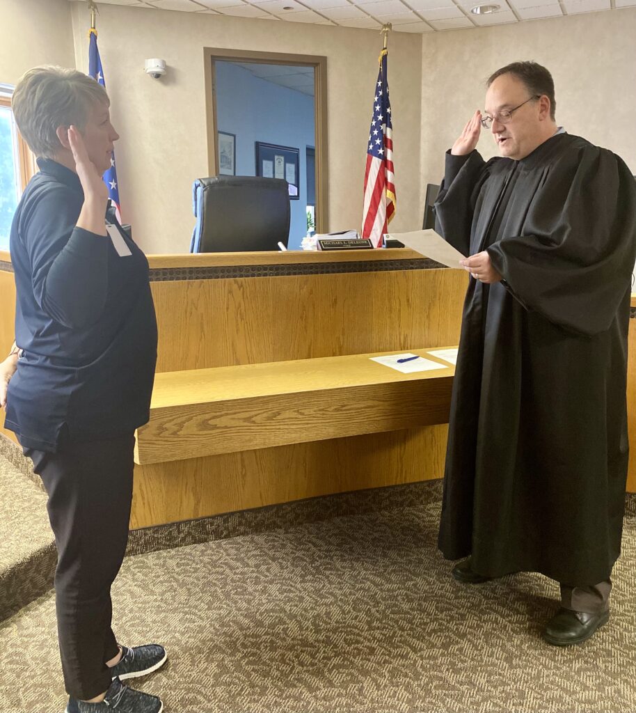 Judge DeLeone swears in a clerks from the Painesville Police Department.