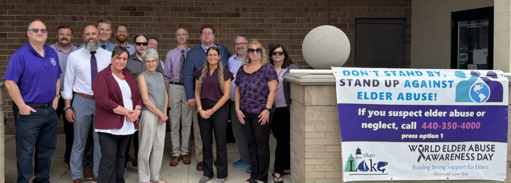 Juvenile Court Staff with Elder Abuse Awareness Day sign