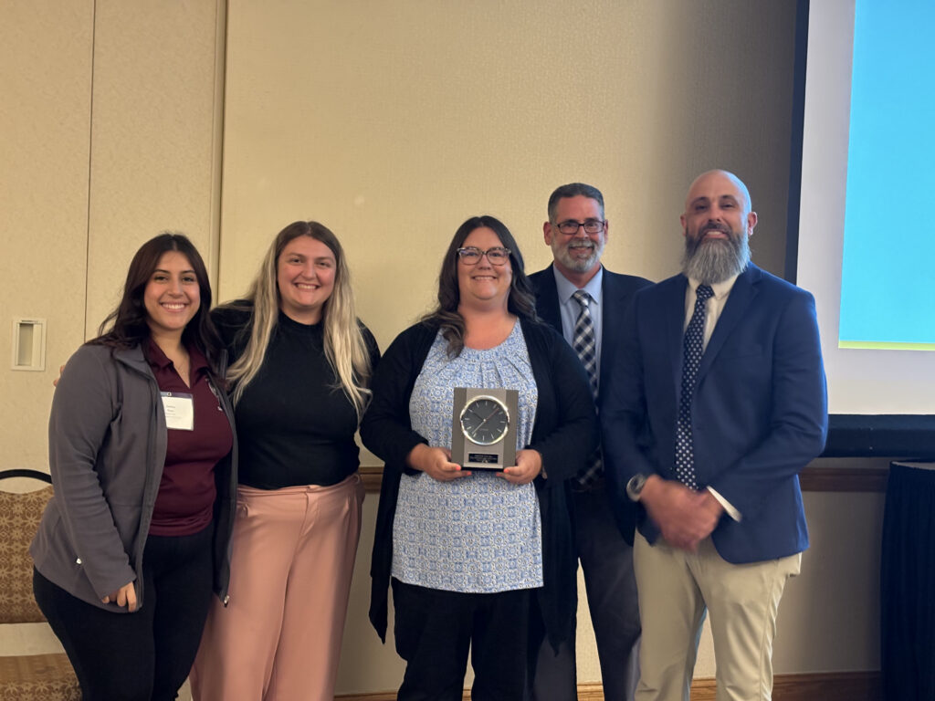 Juvenile Court Clerk, Sharon Delembo and her fellow co-workers, with Ohio Juvenile Clerk’s Association Clerk of the Year award