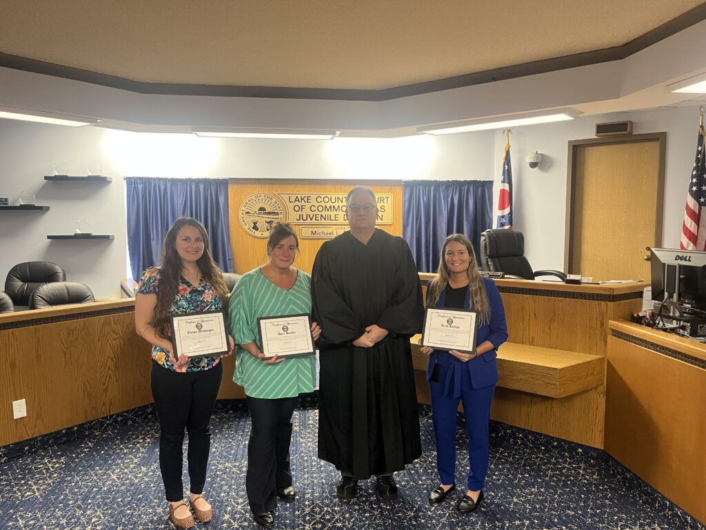 Judge DeLeone standing with Emma Melaragno, April Bayles, and Arial Birtley